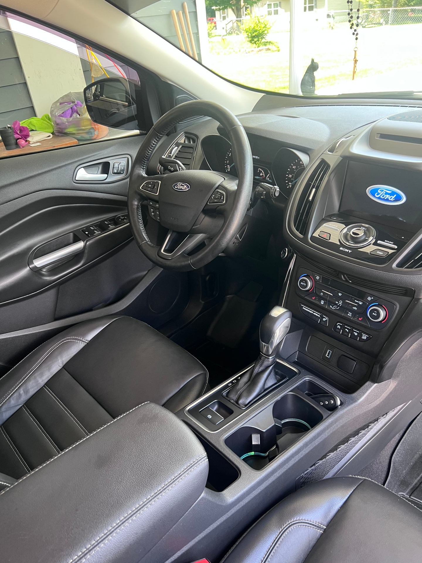 Freshly detailed Ford Escape interior with conditioned leather seats